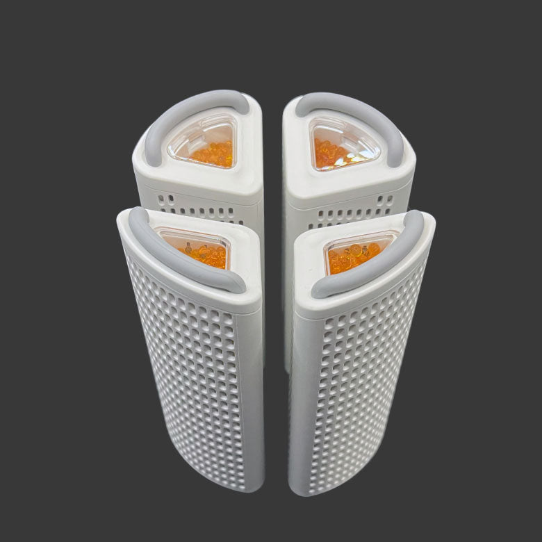 Four white plastic Dry Styx Pods on a light green background