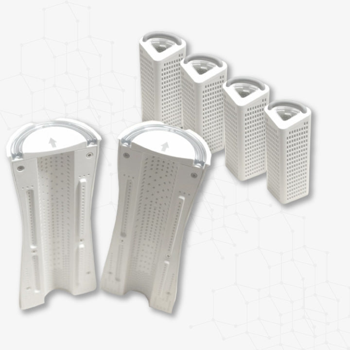 Set of white kitchen tools including a grater and three containers on a light gray background