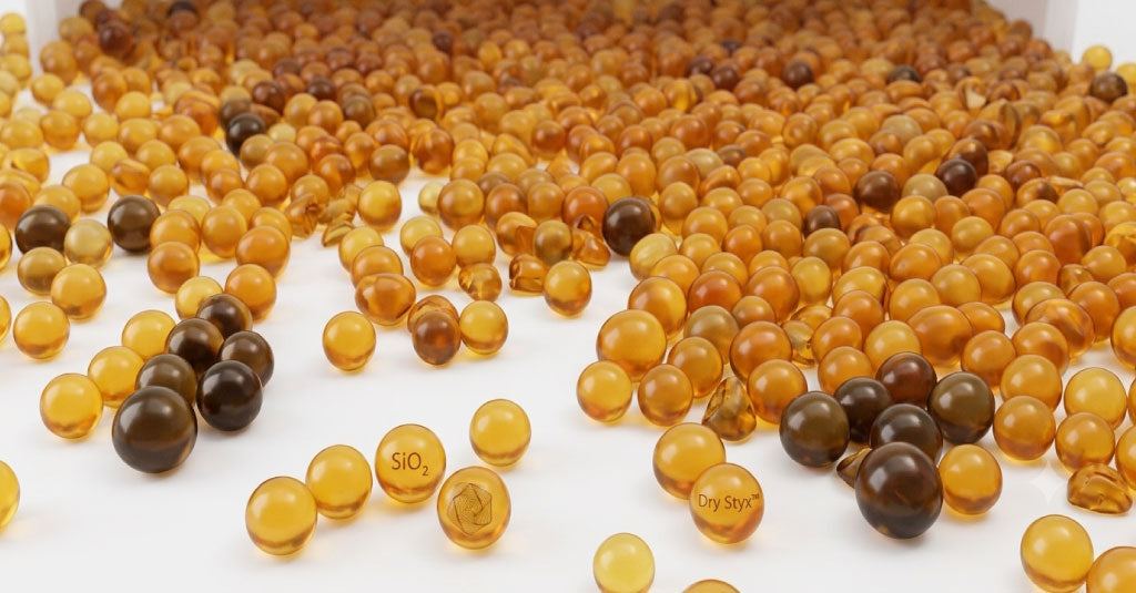 Close-up of amber-colored beads on a white background
